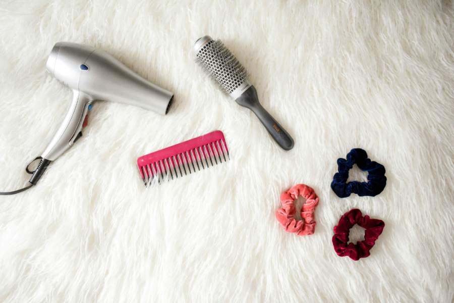 an image of a hairdryer, brushes and scrunchies to illustrate perimenopause hair loss issues